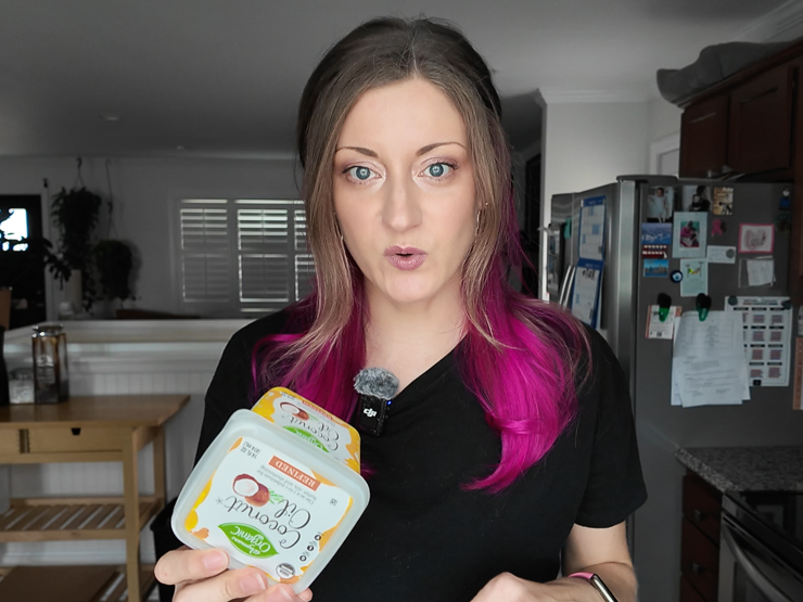 woman holding coconut oil