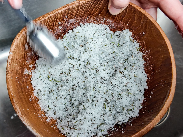 mixing lavender and salt to make a scrub