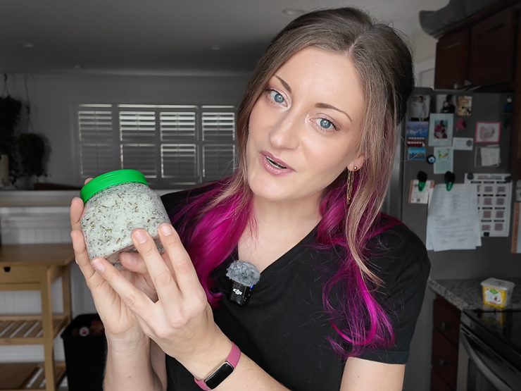 woman holding DIY salt scrub
