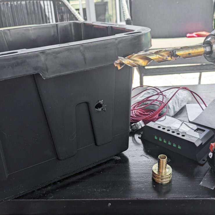 drilling a hole in a plastic utility box