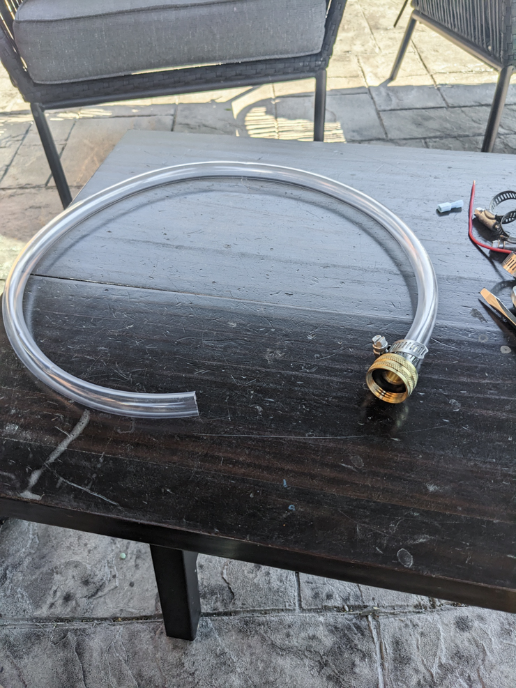 clear tube with a brass fitting on it