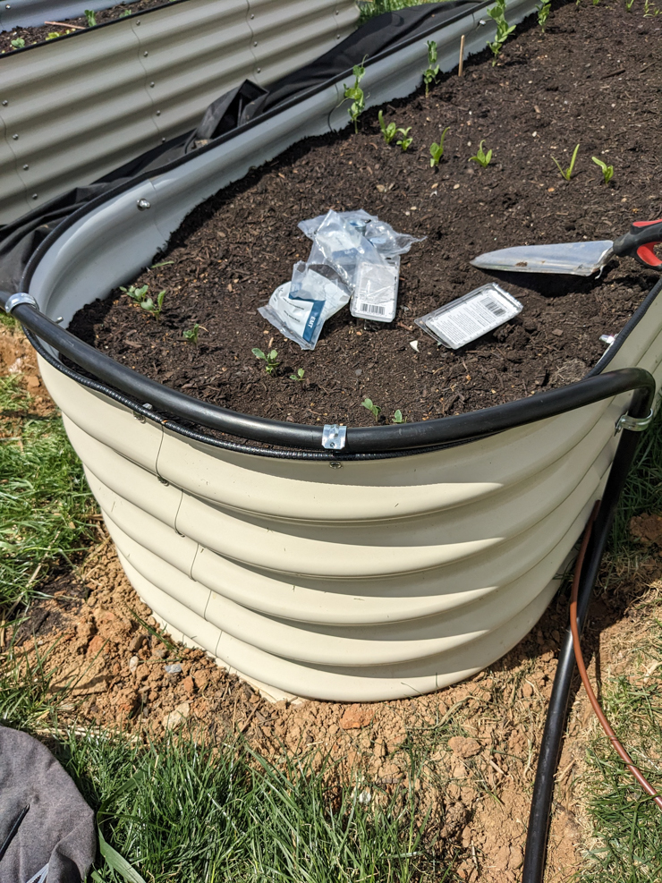 clamping the tubes to the sides of the beds