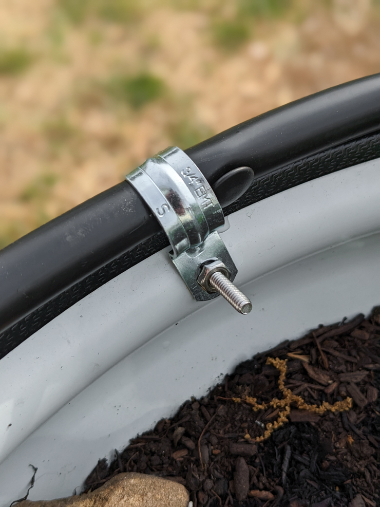 clamping the tubes to the sides of the beds