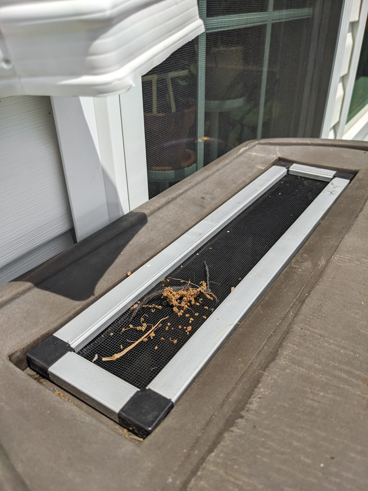 screen on top of a rain barrel