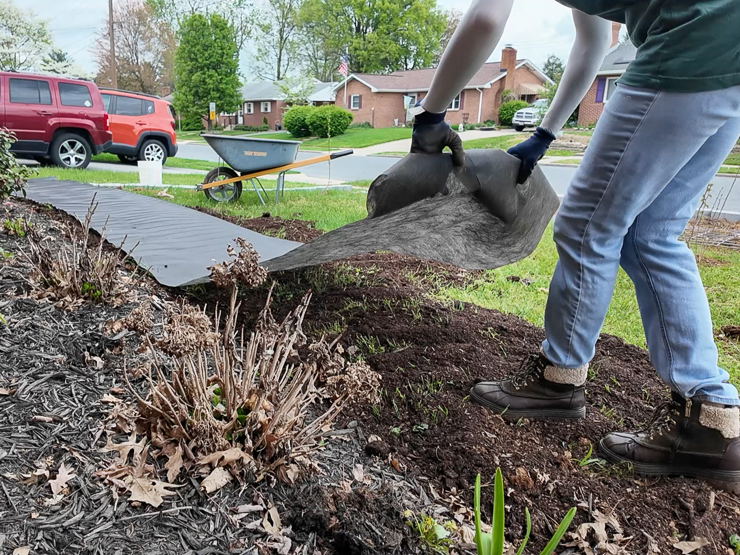spreading landscaping fabric