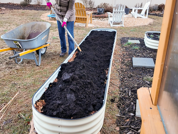 filling the bed the rest of the way with soil