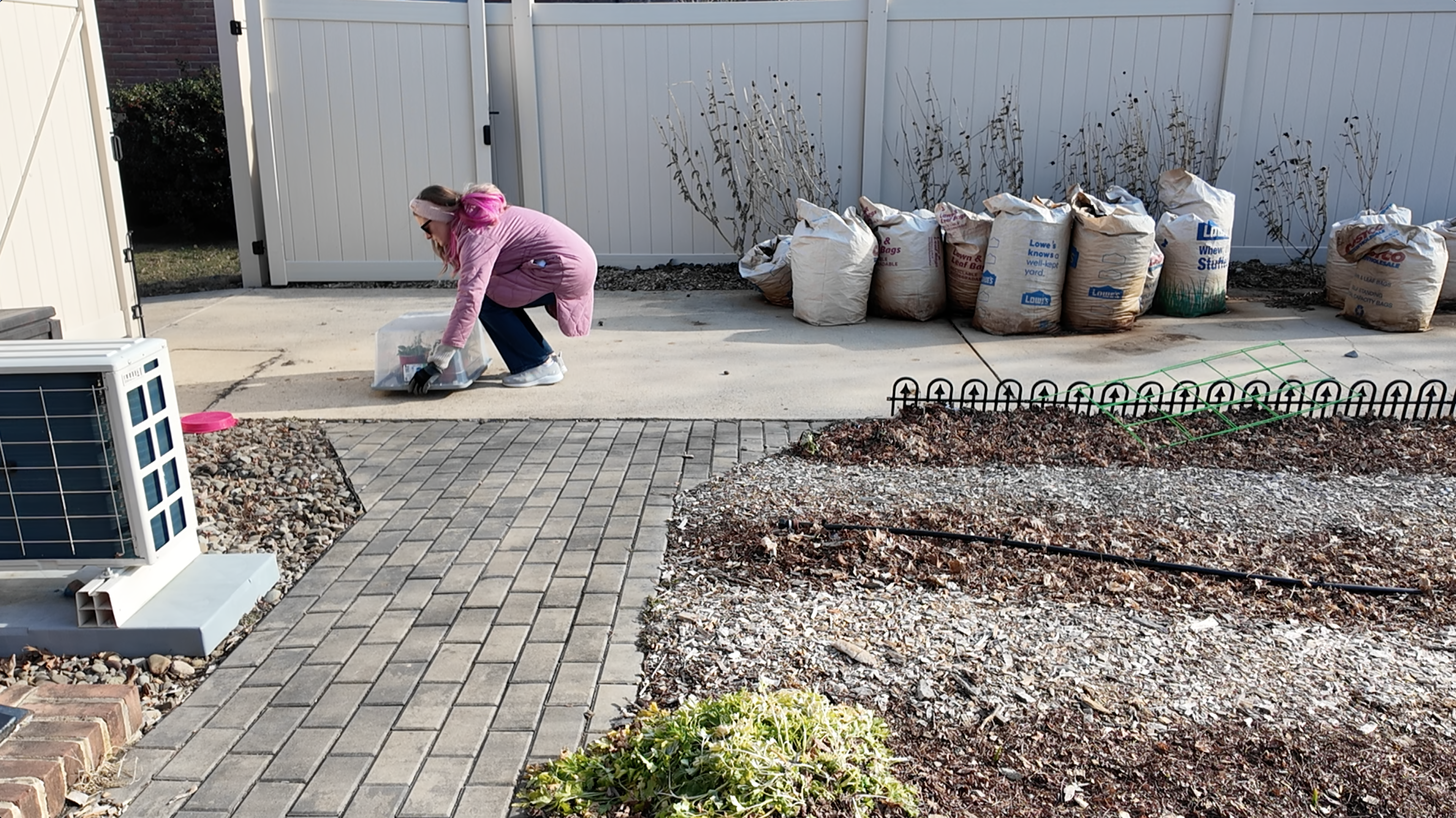 setting a storage bin down outside